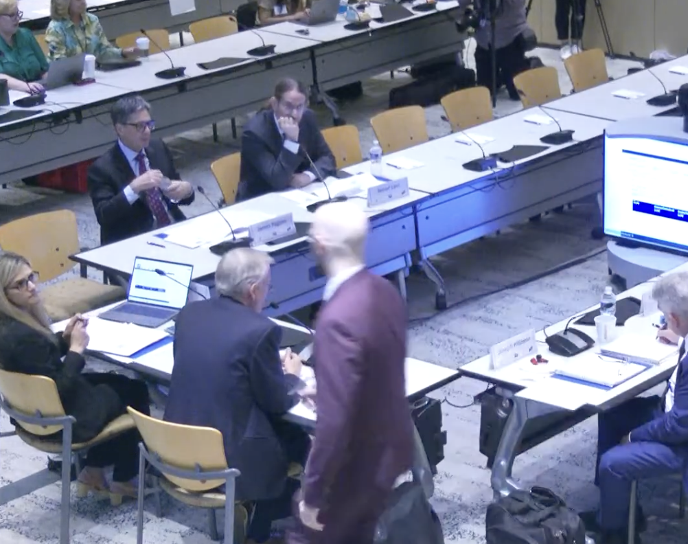 A snapshot of the ACIP committee at CDC. New members sitting around a rectangular table setup.